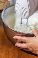 mixer whipping cream into whipped cream