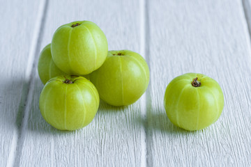 Indian gooseberry on wooden table
