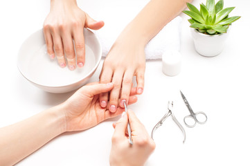 Hands care in the spa. Beautiful woman's hands with perfect manicure