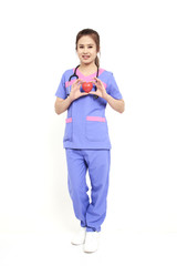 Female doctor with stethoscope holding heart