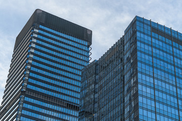 Fototapeta premium Modern office building against blue sky.