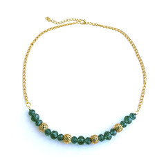 Handmade necklace from green beads and gold chain.