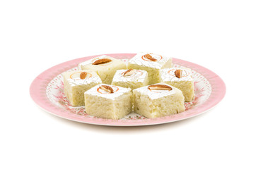 Indian Sweet Food Badam Barfi Also Know As Mithai, barfee, Mawa Barfi, Mava barfi, Almond Sweet, khoya Burfi Indian Popular Sweet Made up of Coconut, Mawa, Milk and Sugar isolated on white background