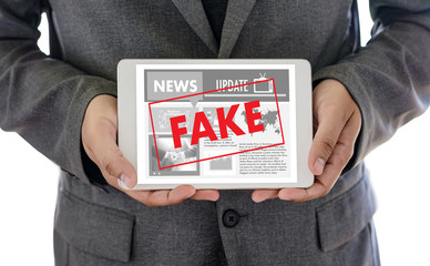 Fake news concept man reading news media technology on smartphone just Fake