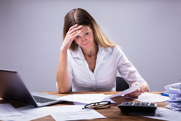 Sad Businesswoman Sitting In Office