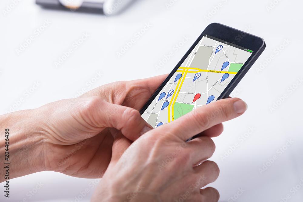 Poster person using gps navigation map on mobile phone