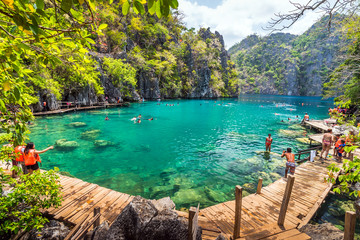 Palawan, Philippines - March 29, 2018. People tourists swimming at Kayangan Lake in Coron Island, Palawan, The Philippines.