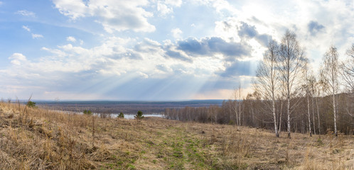 Road and sunlight over the Oka river