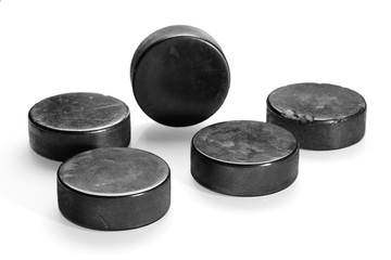 Hockey pucks on a white background
