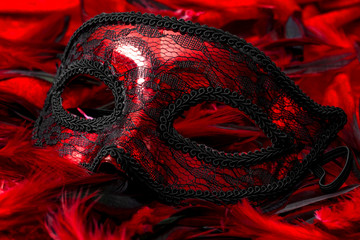 Mystery, carnival disguise and masquerade concept with close up on a party mask on top of black and...