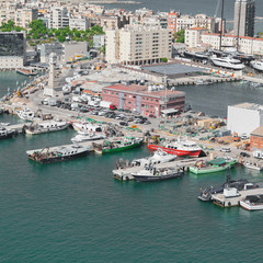 Fototapeta na wymiar Port of Barcelona. Fishing boats scattered on the dock fishing nets