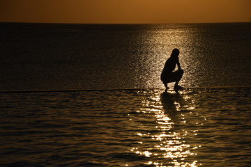 Fototapeta na wymiar Sunset by the sea shore in Zanzibar