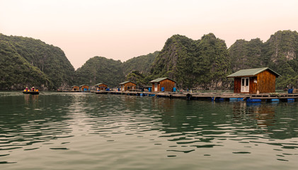 Fototapeta na wymiar Floating village in Halong Bay, Vietnam.