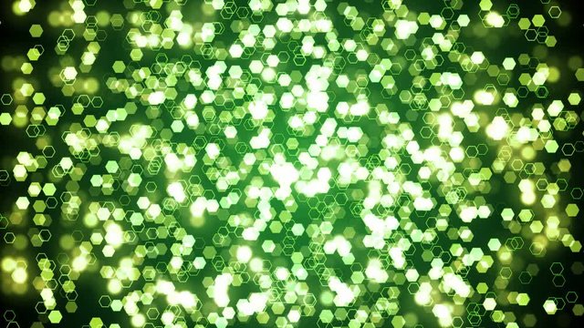 Green glitter hexagon sparkles on dark background. Abstract animation.