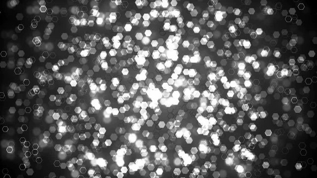 Black glitter hexagon sparkles on dark background. Abstract animation.