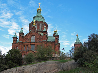 Fototapeta na wymiar Uspenski Cathedral on hill, red turquoise orthodox church, Helsinki, Finland, Europe