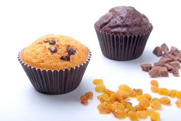 Assorted with Delicious homemade cupcakes with raisins and chocolate isolated on white background. Muffins. Top view. Copy space.