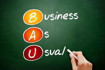 BAU - Business as Usual acronym, business concept on blackboard