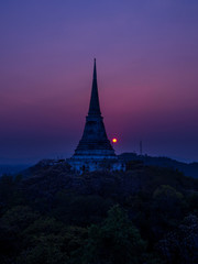 sunset behind pagoda ovr the mountain