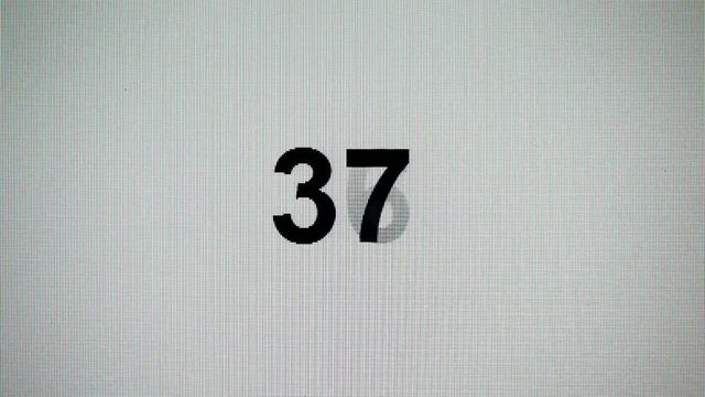 Count down from hundred to zero. Detail of notebbok LCD screen