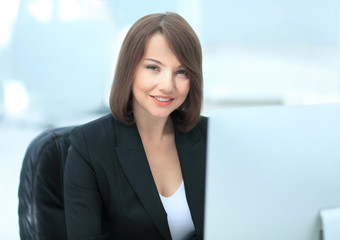 Business woman working with computer in an office