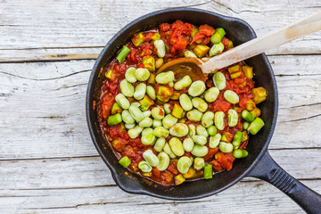 Fried ingredients for the preparation of shakshouka with seasonal vegetables.