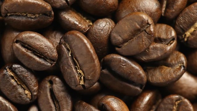 Close up of rotating Coffee Beans. No sound.