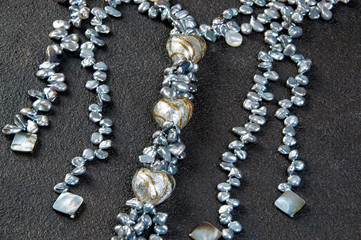 Vintage pearl necklace on black background