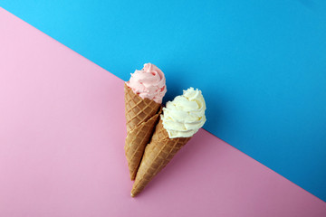 Vanilla frozen yogurt or soft ice cream in waffle cone.