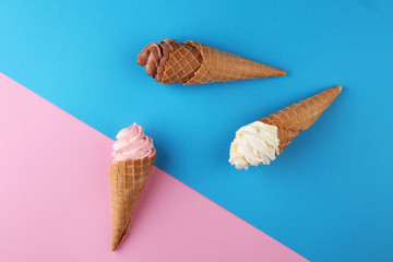 Vanilla frozen yogurt or soft ice cream in waffle cone.