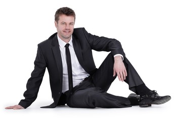 young businessman sitting on floor.