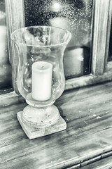 Decorative candle on the window - black and white