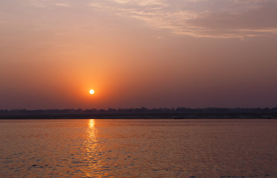 Fototapeta sunrise behind Ganga river in Varanasi, India
