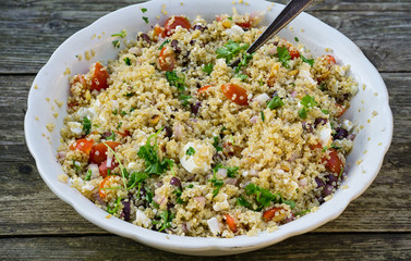Quinoa salad with heirloom tomatoes, mozzarella cheese parsley and red onions.