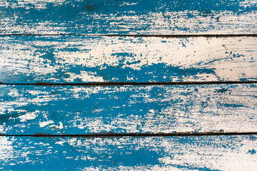 Fototapeta na wymiar Grunge texture : Old wooden table painted with blue and white color, some color peeled off created unique texture.