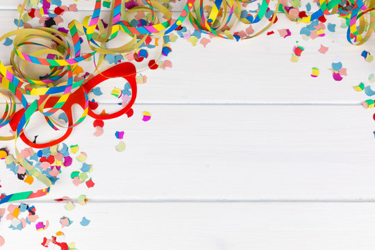 carnival party background with confetti and streamer