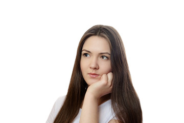 Fototapeta premium beautiful young woman on a white background, serious look, thinks, meditates