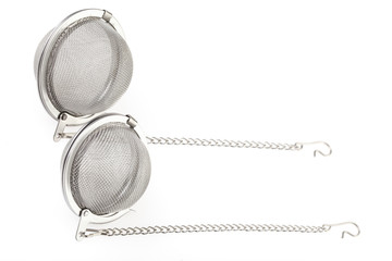 Two tea strainer on a chain isolated for white background.