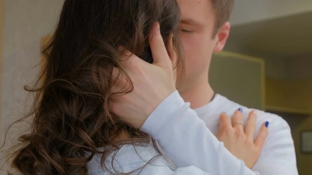 romance love intimacy and sexual arousal. young couple kissing sensually and hugging tenderly