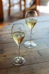 Flutes filled with Prosecco Superiore Cartizze, an italian sparkling white wine, in a restaurant in Conegliano