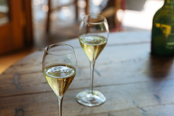 Flutes filled with Prosecco Superiore Cartizze, an italian sparkling white wine, in a restaurant in...