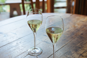 Flutes filled with Prosecco Superiore Cartizze, an italian sparkling white wine, in a restaurant in Conegliano