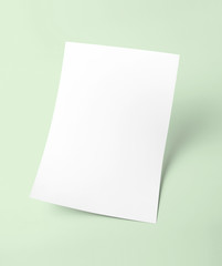Obraz na płótnie Canvas White blank document paper template with green background