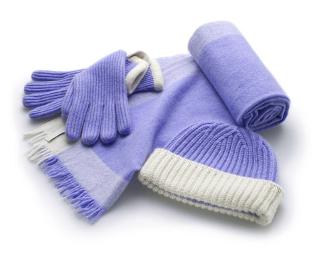 set of winter blue woolen accessorie, scarf, gloves and hat, isolated
