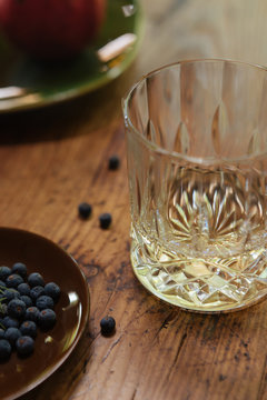 Juniperus communis berries and a glass of gin