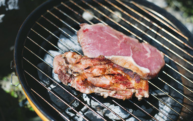 Two Steakes lying on grill.
