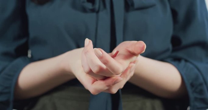Hands of an anxious woman