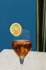 Spritz cocktail in a calix on a table, graphic