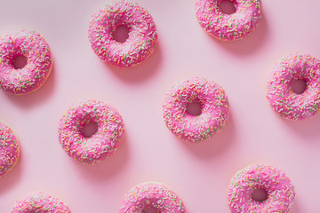 Pattern pink donuts on pink background