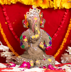 Indian Hindu God Ganesha idol also know as Vinayaka Chaturthi is the Hindu festival, God Ganesha Statue Made of Clay And Coated with Ceramic Colors, Handmade Artistic Effects, Beautiful Artifacts